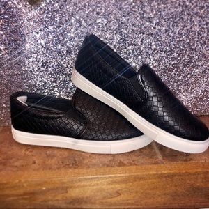 Black leather slip ons